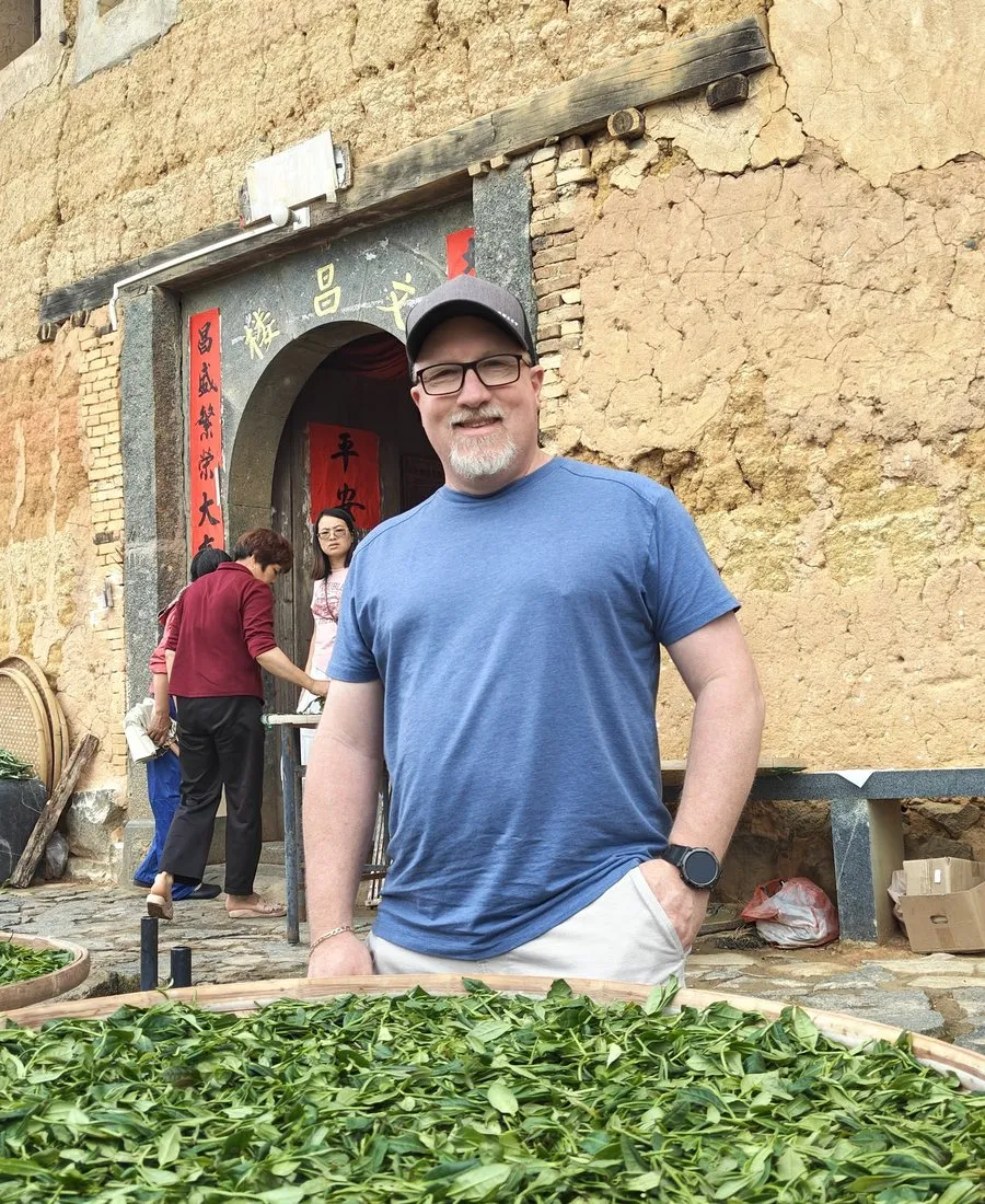 Fresh tea leaves drying in a courtyard in southern China